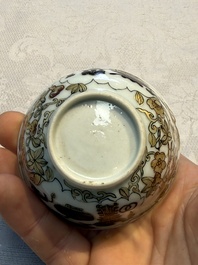 A Chinese gilt-decorated black-enamelled 'Antiquities' cup, Yongzheng/Qianlong