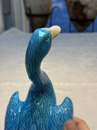 A pair of Chinese turquoise-glazed ducks and a pair of verte biscuit quail-form covered boxes, 20th C.