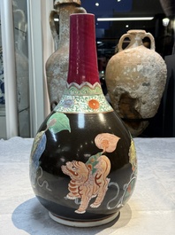 A rare Chinese famille verte black- and ruby-ground 'Buddhist Lions' vase, Kangxi