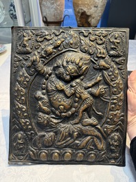 Three Tibetan copper repouss&eacute; plaques with Buddhist subjects, 19th C.