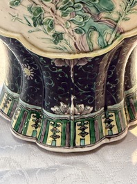 A Chinese verte biscuit black-ground vase and a covered jar, Xuande and Kangxi mark, 19th C.