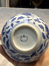 A rare Chinese 'G-marked' blue and white bottle vase with floral design, Kangxi