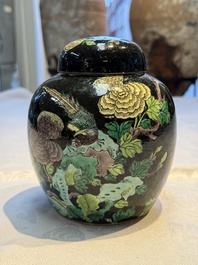 A Chinese verte biscuit black-ground vase and a covered jar, Xuande and Kangxi mark, 19th C.