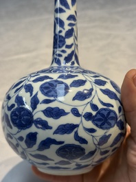 A rare Chinese 'G-marked' blue and white bottle vase with floral design, Kangxi