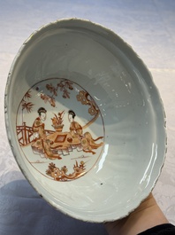 A pair of Chinese  iron-red and gilt-decorated 'Elegant Ladies and Tulips' bowls and covers, Kangxi