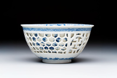 A Chinese blue and white reticulated double-walled 'Swastika' bowl, Kangxi