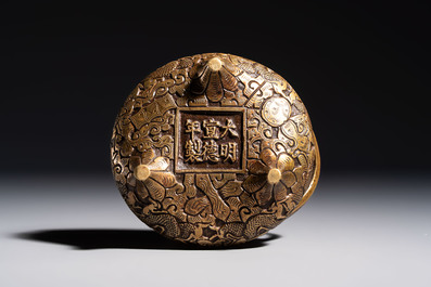 A Chinese bronze tripod 'Dragon' censer with two handles, Xuande mark, 19th C.