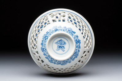A Chinese blue and white reticulated double-walled 'Swastika' bowl, Kangxi