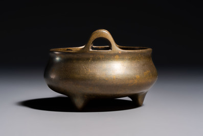 A Chinese bronze two-handled tripod censer, Xuande mark, 19th C.