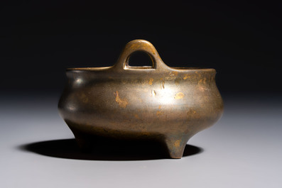 A Chinese bronze two-handled tripod censer, Xuande mark, 19th C.