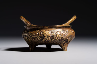 A Chinese bronze tripod 'Dragon' censer with two handles, Xuande mark, 19th C.