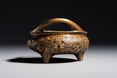 A Chinese bronze tripod 'Dragon' censer with two handles, Xuande mark, 19th C.