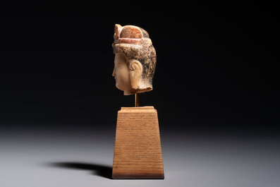 A rare Chinese polychrome carved white marble head of a Bodhisattva on a stand, Northern Qi