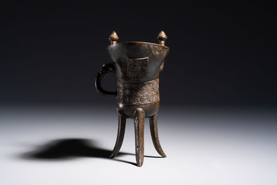 A Chinese archaistic bronze ritual wine vessel, Jue 爵, Qianlong mark, dated 1738