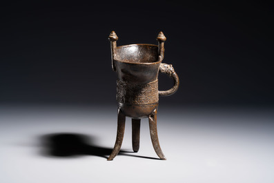 A Chinese archaistic bronze ritual wine vessel, Jue 爵, Qianlong mark, dated 1738
