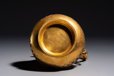 An Ottoman gilt-metal jug with stylised floral design, 19/20th C.