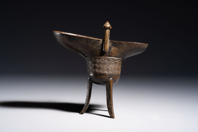 A Chinese archaistic bronze ritual wine vessel, Jue 爵, Qianlong mark, dated 1738