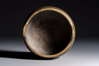 A Chinese bronze two-handled tripod censer, Xuande mark, 19th C.