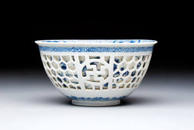 A Chinese blue and white reticulated double-walled 'Swastika' bowl, Kangxi