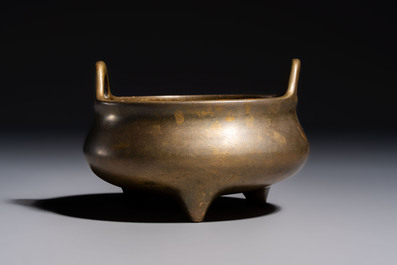 A Chinese bronze two-handled tripod censer, Xuande mark, 19th C.