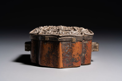 A Tibetan silver and copper Ghau or prayer box, 19th C.