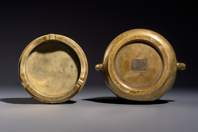 A fine Chinese bronze censer with loop handles and stand, Xuande mark, 18th C.