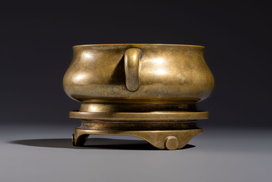 A fine Chinese bronze censer with loop handles and stand, Xuande mark, 18th C.