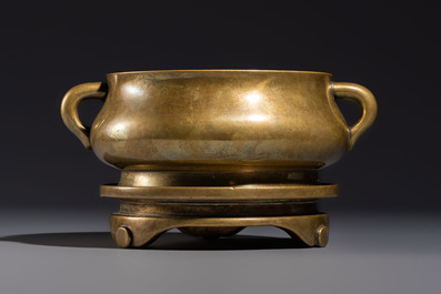 A fine Chinese bronze censer with loop handles and stand, Xuande mark, 18th C.