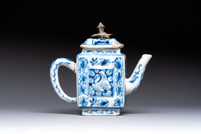 A rare blue and white Dutch Delft relief-moulded teapot and cover, late 17th C.