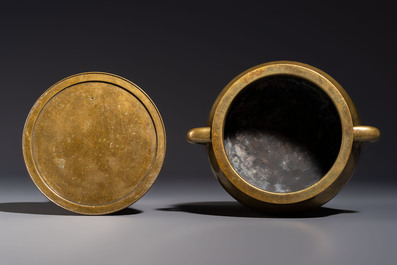 A fine Chinese bronze censer with loop handles and stand, Xuande mark, 18th C.