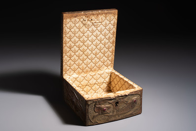 Alfred Daguet (Paris, 1875-1942): An Art Nouveau repouss&eacute; copper-mounted box with aquatic animals and inset glass eyes, monogrammed A.D., ca. 1900