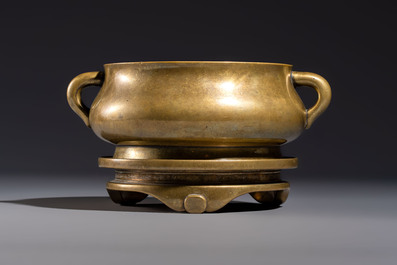 A fine Chinese bronze censer with loop handles and stand, Xuande mark, 18th C.