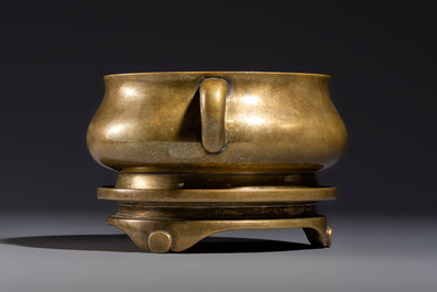 A fine Chinese bronze censer with loop handles and stand, Xuande mark, 18th C.
