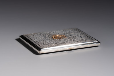 An Iranian silver and gilt cigarette case commemorating Mohammad Reza Pahlavi's coronation, 20th C.