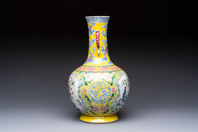 A Chinese famille rose yellow-ground 'Bats and Peaches' bottle vase, Jiaqing/Daoguang