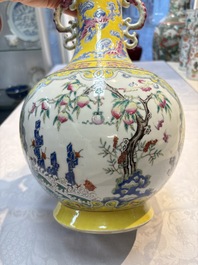 A Chinese famille rose yellow-ground 'Bats and Peaches' bottle vase, Jiaqing/Daoguang