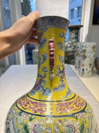 A Chinese famille rose yellow-ground 'Bats and Peaches' bottle vase, Jiaqing/Daoguang