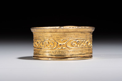 A fine Tibetan gilt-bronze box and cover with repouss&eacute; scroll decoration, 18th C.
