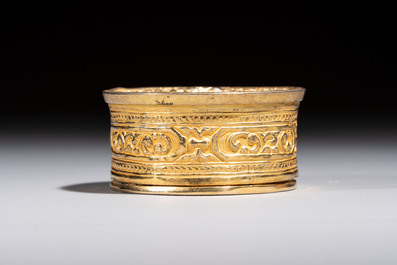 A fine Tibetan gilt-bronze box and cover with repouss&eacute; scroll decoration, 18th C.