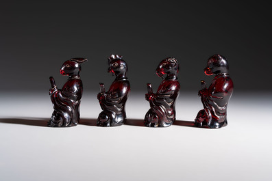 A rare complete set of 12 Chinese cherry amber 'Zodiac' figures on wooden stands, Qianlong mark, Republic