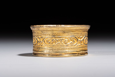 A fine Tibetan gilt-bronze box and cover with repouss&eacute; scroll decoration, 18th C.