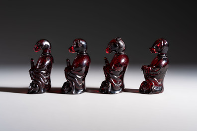 A rare complete set of 12 Chinese cherry amber 'Zodiac' figures on wooden stands, Qianlong mark, Republic