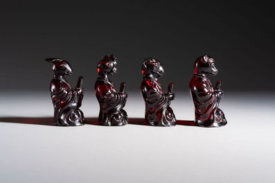 A rare complete set of 12 Chinese cherry amber 'Zodiac' figures on wooden stands, Qianlong mark, Republic