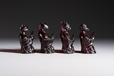 A rare complete set of 12 Chinese cherry amber 'Zodiac' figures on wooden stands, Qianlong mark, Republic