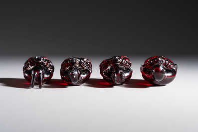 A rare complete set of 12 Chinese cherry amber 'Zodiac' figures on wooden stands, Qianlong mark, Republic