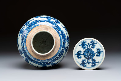 A Chinese blue and white covered jar and two polychrome-decorated jarlets with wooden covers, 18/19th C.