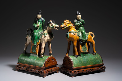 A pair of Chinese sancai-glazed 'Horseriders' roof tiles on wooden stands, Ming