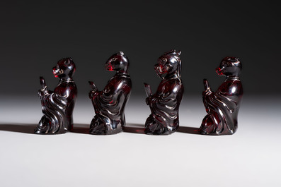 A rare complete set of 12 Chinese cherry amber 'Zodiac' figures on wooden stands, Qianlong mark, Republic