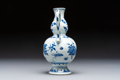 A Chinese blue and white 'Floral' ewer, Transitional period