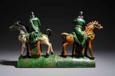 A pair of Chinese sancai-glazed 'Horseriders' roof tiles on wooden stands, Ming